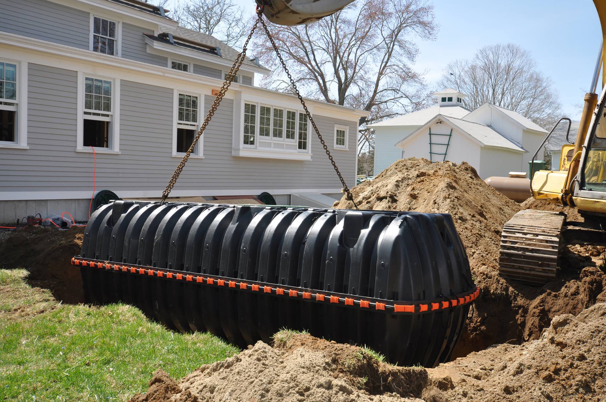 Installation of a septic tank and leach lines on a rural property.