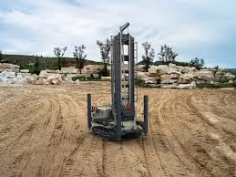 Alt: Water well drilling on a rural land parcel in Oakhurst California.